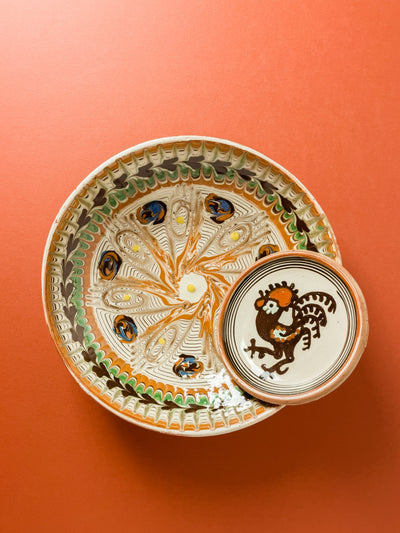 farfurie-20cm-ceramica-horezu-stefanescu-ou-ochi-centru-muguri-albastru-caramiziu-coroana-inimi-maro-1